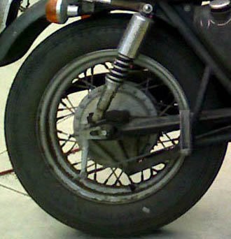 Honda 750 with lowering blocks and Harley rear rim